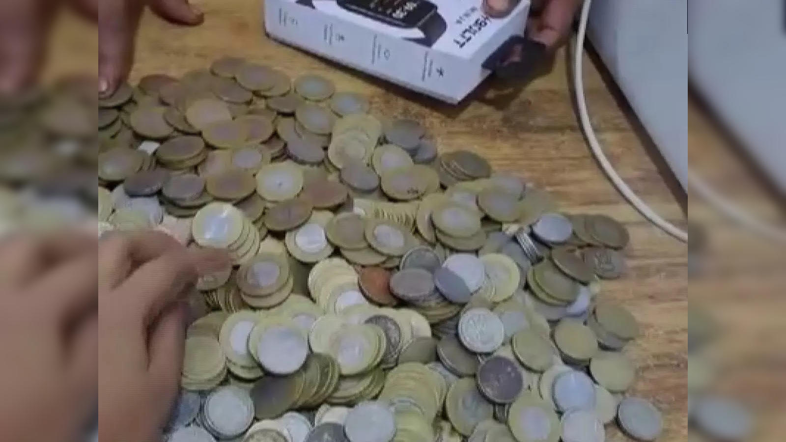 Assam shopkeeper pays for dream scooter in coins