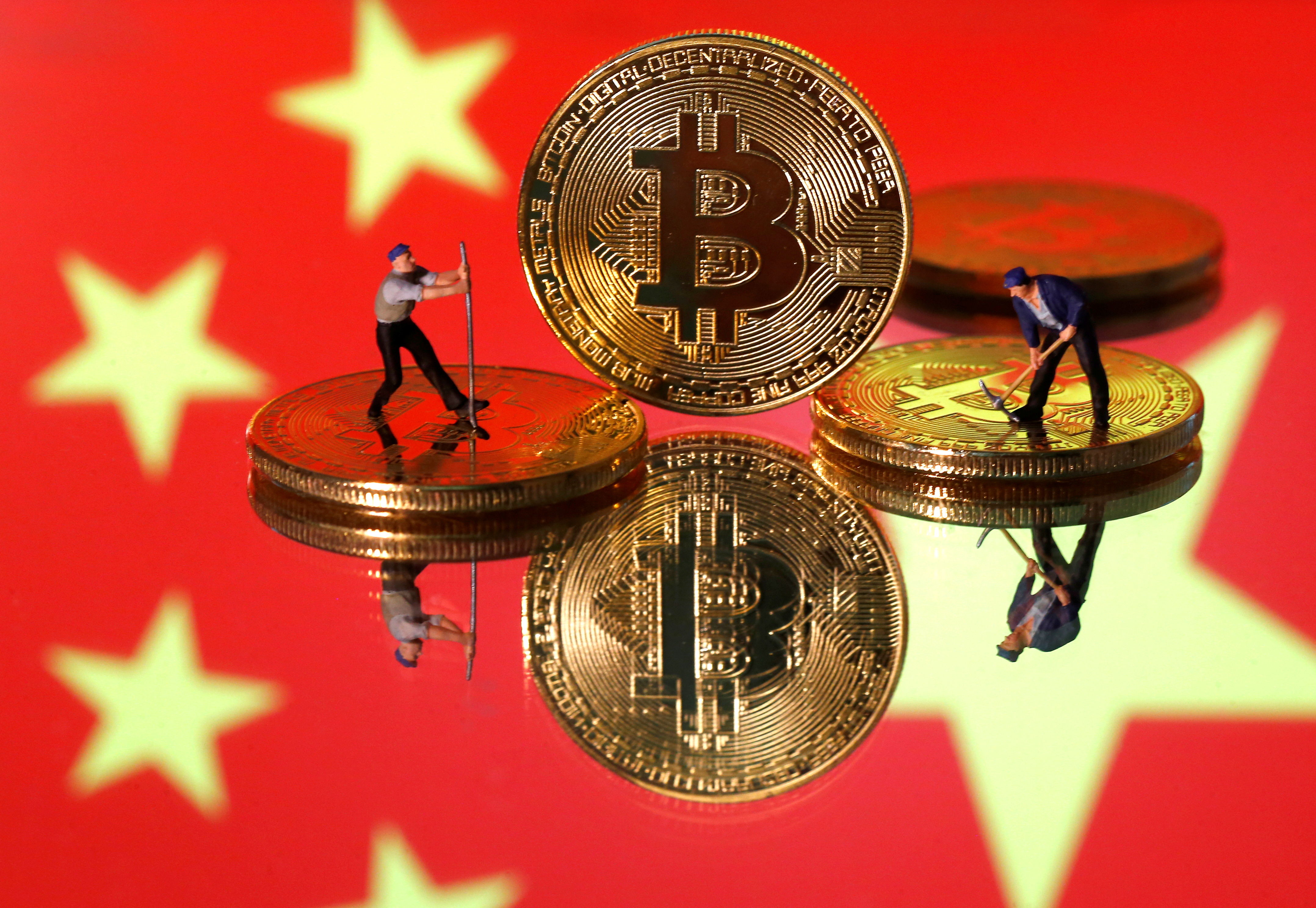 China's top regulators ban crypto trading and mining, sending bitcoin tumbling | Reuters