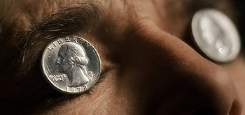 If You See A Coin Placed On Someone's Grave, Here's What It Means